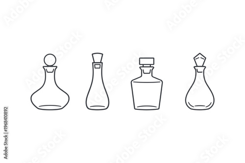 Collection of four distinct glass decanters and bottles with stoppers
