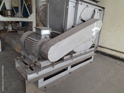 Fotografija Industrial centrifugal fans, also known as blowers, are designed to circulate air, gas, or light materials such as dust through a duct system in a factory environment