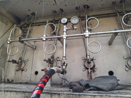 The control panel for an industrial gas management system, or CNG (Compressed Natural Gas), is used for the storage and transportation of high-pressure gas. High-Pressure Pipes and Valves: This system