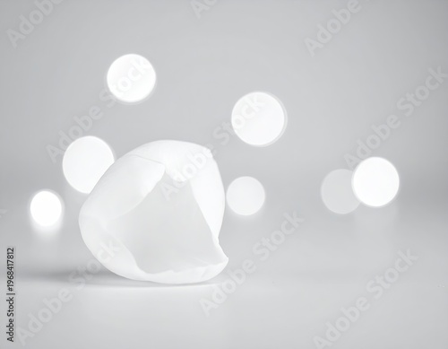 White abstract geometric shape with glowing circles background.