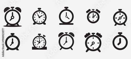 Collection of Ten Alarm Clock and Clock Silhouettes Keywords: clock, alarm clock, time, timepiece, watch, hour, minute, second, icon, symbol