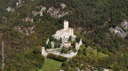 Cinematic aerial drone view of FAI Castello di Avio. Medieval castle and historic landmark in Trentino, Italy.