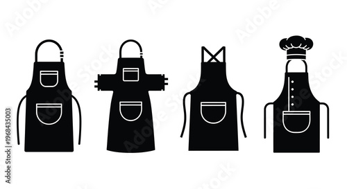 Four black aprons and a chef s hat in stark silhouette