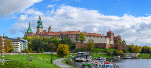 Panorama of Wawel Castle and Cathedral on the Vistula River in Krakow, Poland on a sunny autumn day. Panoramic view