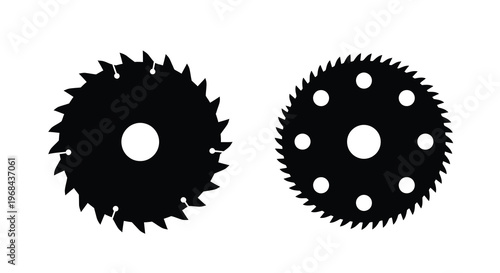 Two circular saw blades depicted in stark black silhouette