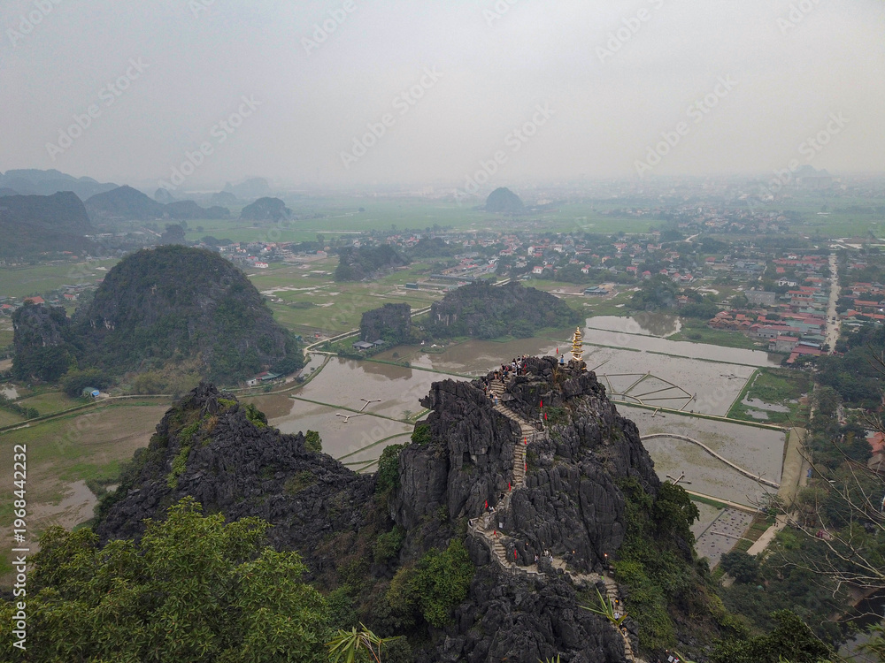 Fototapeta premium Pagoda at Hang Mua Peak Overlooking Karst Landscape in Vietnam