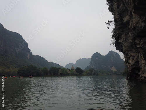 Obraz na płótnie River and limestone mountains near Ninh Binh Vietnam