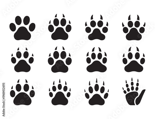 Twelve stylized black paw prints and one handprint in grid formation on white background isolated vector art.