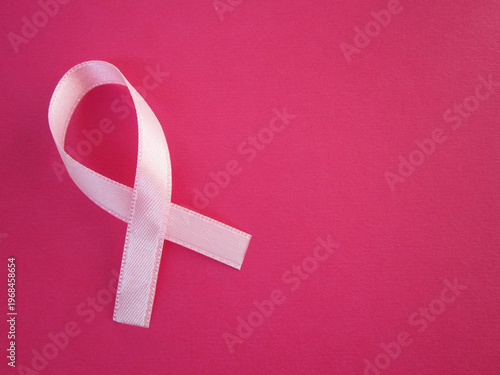       The pink ribbon is a breast cancer awareness symbol.                         
