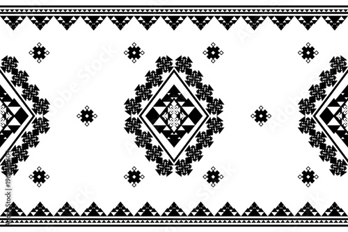 Minimalist black and white seamless geometric pattern featuring a large tribal diamond motif with triangular borders.