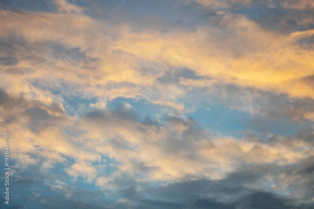 Obraz premium Bright cumulus clouds at sunset.