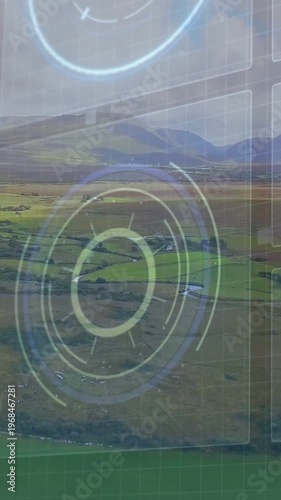 Vertical video: HUD overlay appearing over valley, camera drifting, rings rotating for farm mapping