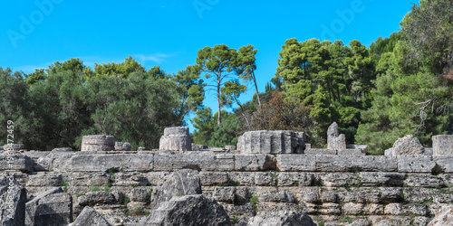 Ancient Temple Ruins Among Trees in Olympia, Greece