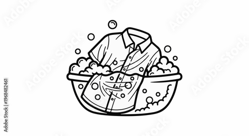 A shirt is being washed by hand in a basin filled with soapy water and bubbles