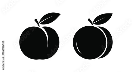 Two black fruit shapes with leaves a striking silhouette