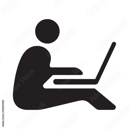 Simple black icon depicting a person sitting and using a laptop