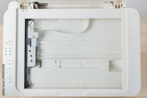 Bilde på lerret Flatbed scanner bed inside a multifunction office printer shown from above