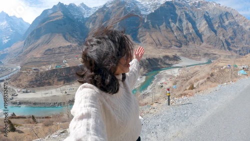 4K selfie shot of Indian woman vlogging while travel in mountains at Lahaul, Himachal Pradesh, India. Influencer woman talking on live stream at social network platform for subscribers, followers.  Fe