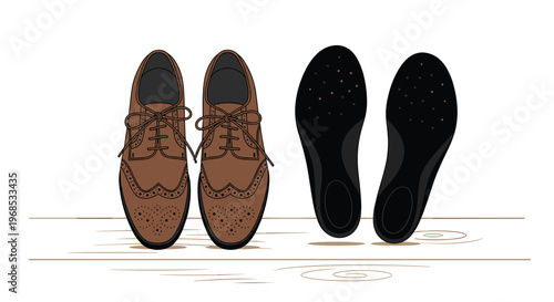 A pair of brown leather brogue shoes stands next to black shoe insoles on a light wooden surface.
