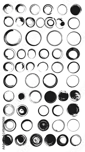 Collection of assorted black circles, with varying thicknesses and fills on a white background, suggesting ink or brush strokes