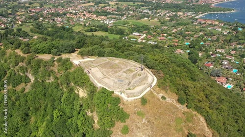 Italy's Rocca di Manerba. Medieval castle ruins. Drone footage, sunny, diverse angles.
