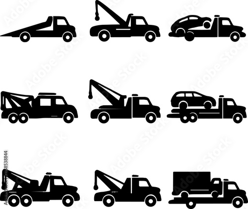 black silhouettes of various tow trucks and cars