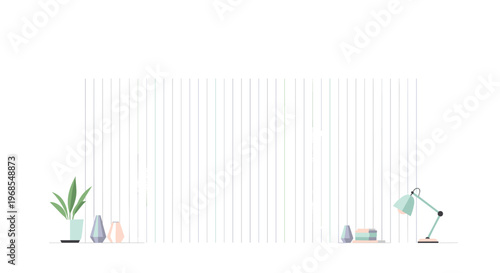 A white striped wall serves as a background for a potted plant, vases, a desk lamp, and books on a white surface.