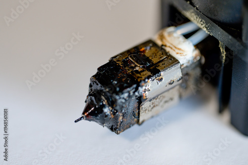 Selective focus on charred and plugged hot end extruder of a 3D filament printer 