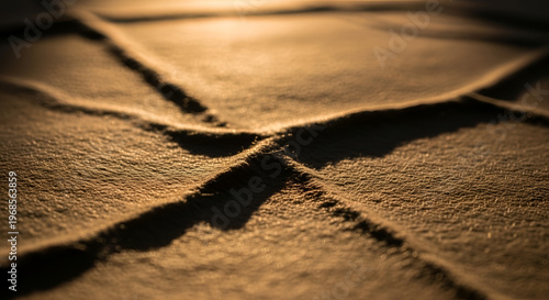 Warm Golden Hour Light on Textured Fabric Surface with Cross-Shaped Shadows, Abstract Soft Textile Background with Dreamy Sunset Glow, Minimalist Concept of Light and Shadow on Cozy Material