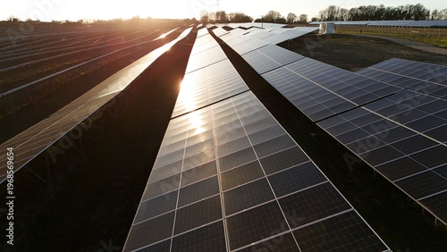 Tableau sur toile Sunset aerial view of solar panels near Ipswich UK with golden light glinting of