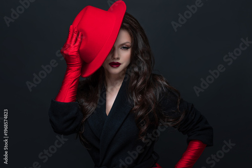 Luxurious brunette red hat gloves dark elegance