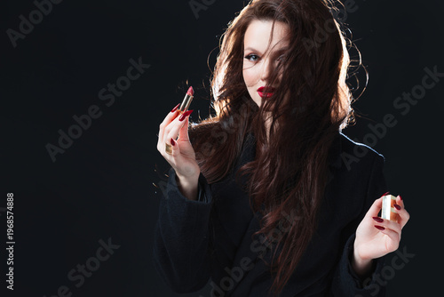 Luxury beauty brunette with red lipstick close-up