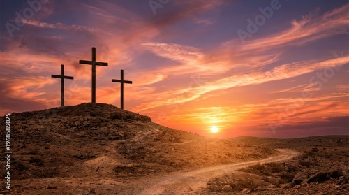 Silhouette of three wooden religious crosses above the hill against a dramatic sky and sunbeams at sunset or sunrise. Religious symbol of good Friday.