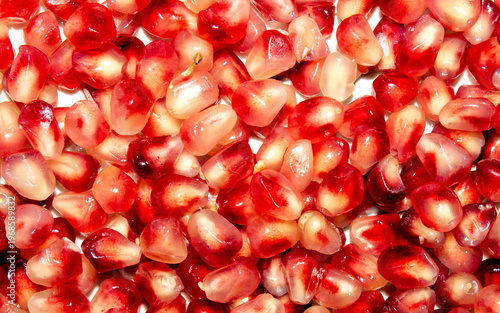 Pomegranate seeds are peeled.The texture of a ripe pomegranate.Pomegranate ripe background.