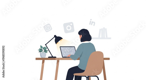 A woman sits at a desk working on a laptop with a lamp and plant nearby in a simple setting