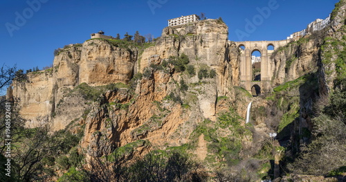 Visit to Ronda in Spain with views of the cliffs, bridge, and landscape during a sunny day