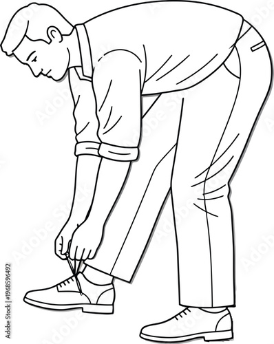 Man meticulously tying the laces on his formal dress shoe in black and white.