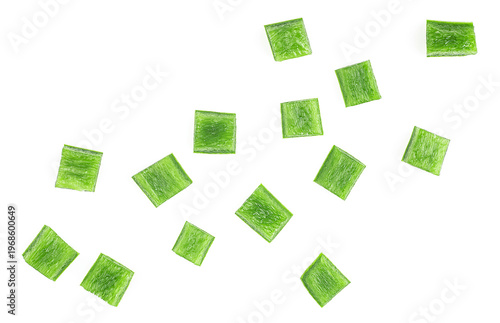 Green bell pepper pieces isolated on a white background, top view. Green paprika cubes.