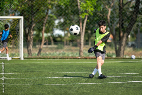 International school student practicing soccer dribbling