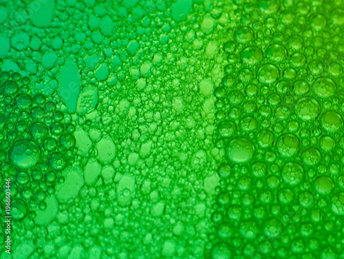 Wallpaper Mural Close-up of numerous green bubbles of various sizes on a gradient green background with a shallow depth of field. Torontodigital.ca