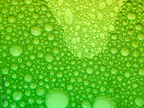 Wallpaper Mural Close-up view of numerous green bubbles of various sizes on a green background with a gradient effect and shallow depth of field. Torontodigital.ca
