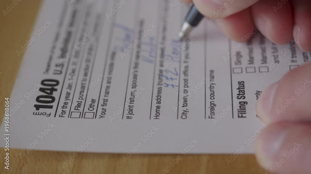 Man Filling In The Tax Form 1040. Person Calculates of Planning Budgets ...