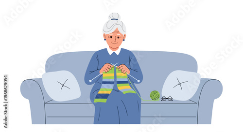 An elderly woman sitting on a comfortable blue couch and knitting with green yarn