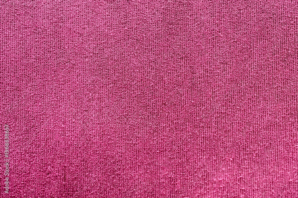 Fototapeta premium Dark pink fabric abstract background with detailed rough surface