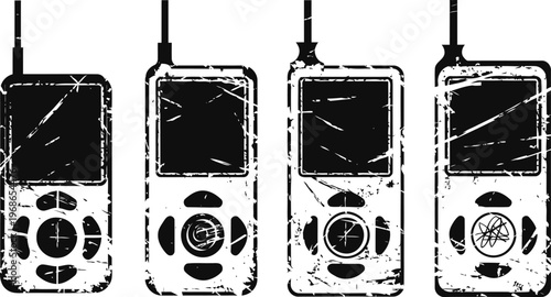 Four vintage mobile phones with scratched and worn screens standing in a row on white background