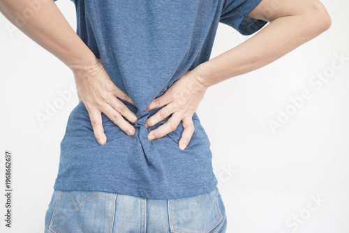 Woman suffering from back pain isolated on white background. Health care concept.