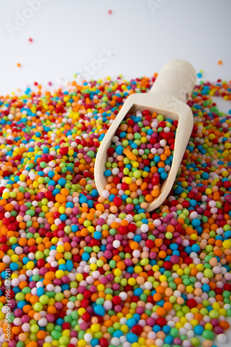 Colorful Rainbow Sprinkles with Wooden Scoop