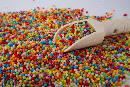 Colorful Rainbow Sprinkles with Wooden Scoop