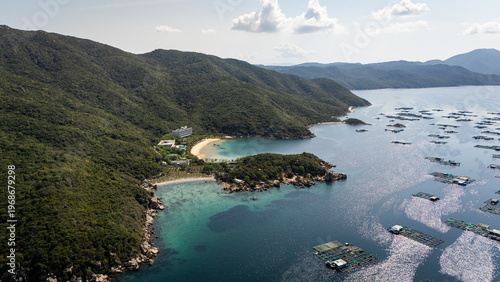 Quadro em tela Aerial Drone View of Turquoise Inshore Waters and Rugged Coastline at Dai Lanh P