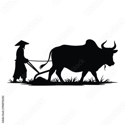 Silhouette of a farmer plowing a field with an ox or water buffalo